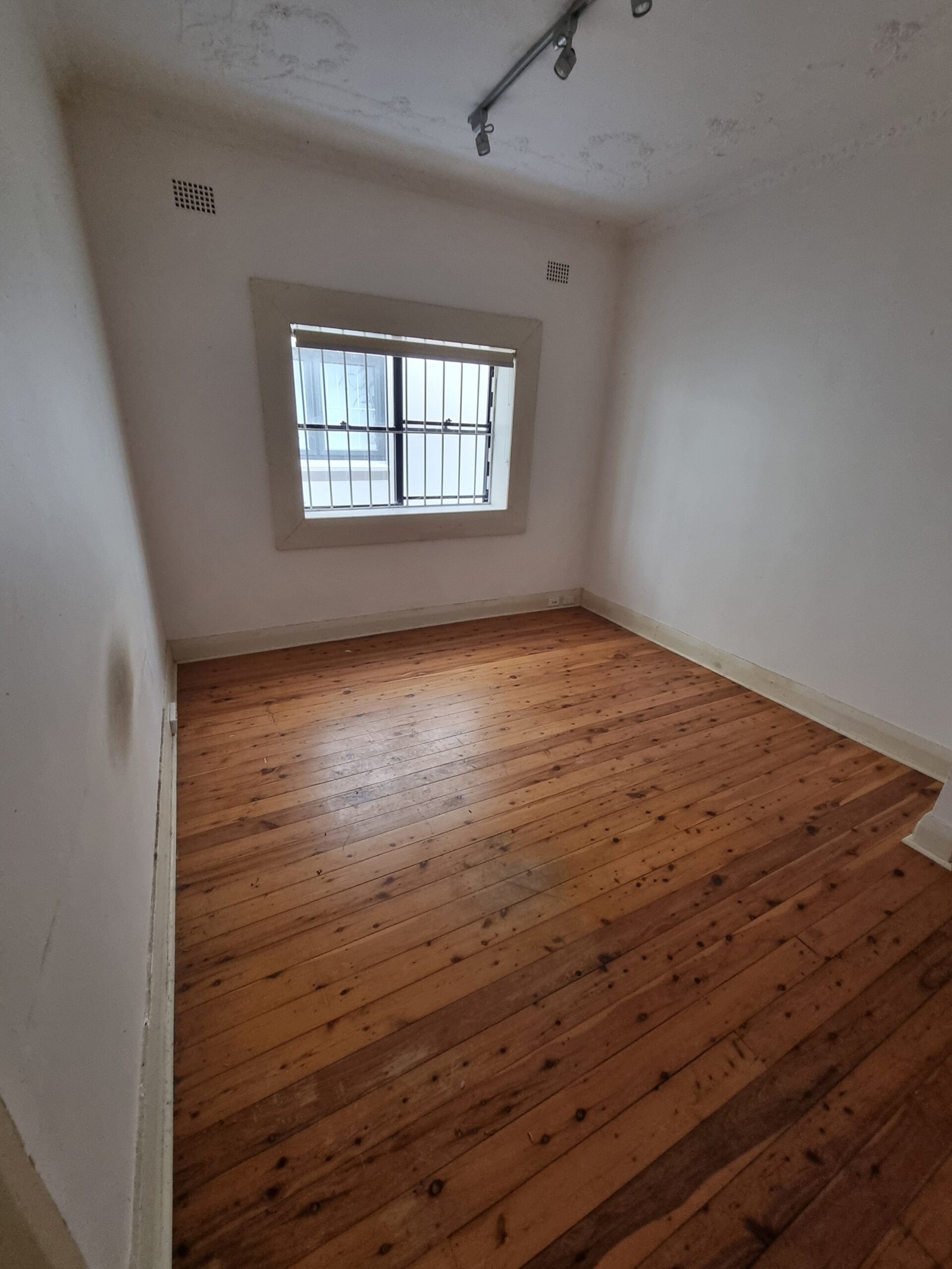 What Happens to Furniture During an Estate Clearance? Empty room with timber flooring after removal of furniture and household contents